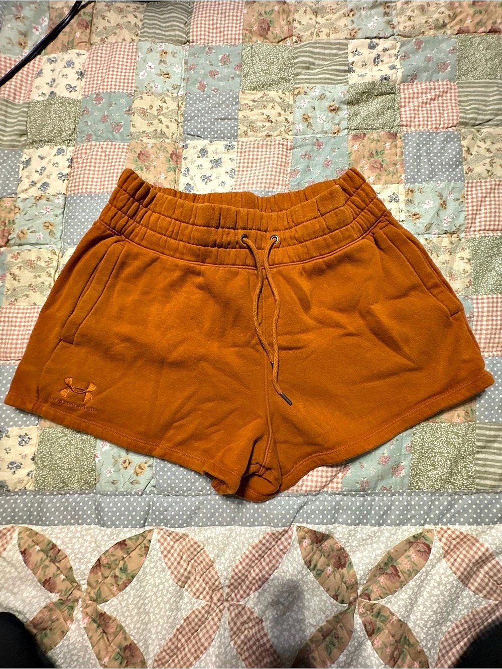 Under Armour Rival Fleece Shorts burnt orange.